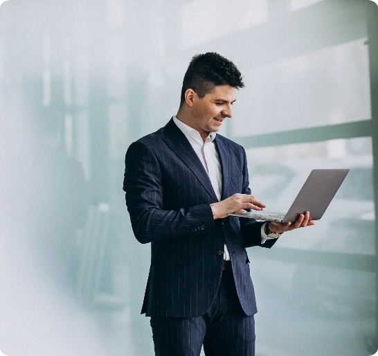 young-handsome-business-man-with-laptop-office